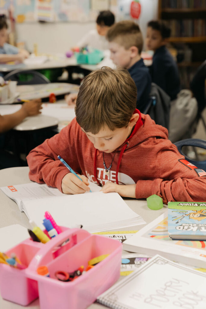 0O5A97262-Enhanced-NR student working on homework assignment