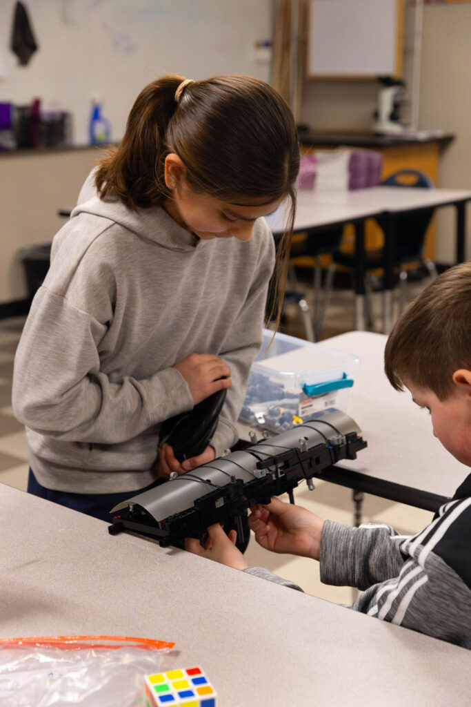 0O5A9840-Enhanced-NR middle school students work together on a science project