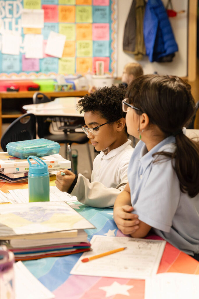 0O5A9877-Enhanced-NR two students at new summit charter academy working on a project